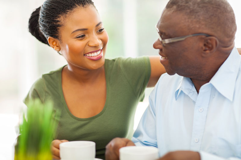 Photo of woman being friendly to a senior man